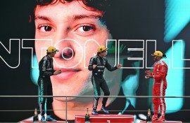 Winner Mercedes' Italian driver Kimi Antonelli (C), second-placed Mercedes' British driver George Russell (L) and third-placed Ferrari's British driver Lewis Hamilton (R) celebrate on the poidum after the Formula One Chinese Grand Prix at the Shanghai International Circuit in Shanghai on March 15, 2026.