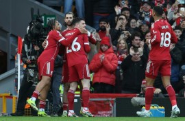 Liverpool midfielder Dominik Szoboszlai (2nd L) celebrates after scoring the opening goal of a 1-1 Premier League draw with Tottenham Hotspur at Anfield