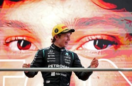 Kimi Antonelli celebrates on the podium after winning the Formula One Chinese Grand Prix