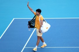 Early exit: World number one Carlos Alcaraz waves to fans after falling to 36th-ranked Sebastian Korda in the third round of the Miami Open