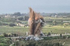 Smoke rises from an Israeli airstrike on the Qasmiyeh bridge in south Lebanon