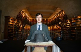 The director of Musee Conde, Mathieu Deldicque, poses with a hat believed to have belonged to Napoleon Bonaparte