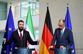 German Chancellor Friedrich Merz (R) and Syrian President Ahmed al-Sharaa address a joint press conference