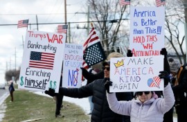 Demonstrators take part in the 'No Kings' national day of protest in West Bloomfield, Michigan, a suburb of Detroit