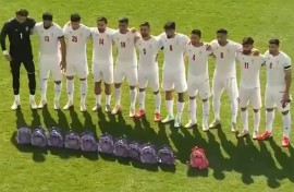 This video grab taken from images released by the Iranian state broadcaster (IRIB) on March 27, 2026 and released via AFPTV, shows the country's football national team paying tribute to the victims of the February 28 strike on an elementary school in Minab, ahead of their friendly football match with Nigeria in Turkey's Antalya