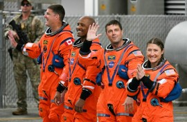 From left: Jeremy Hansen, Victor Glover, Reid Wiseman and Christina Koch heading toward the launch pad on Wednesday