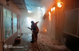 Ukraine's State Emergency Service released images of its firefighters at the scene of the strike on the market in Nikopol