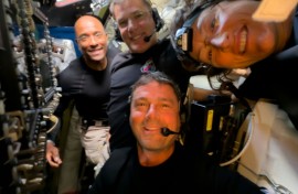 This handout picture released on April 7, 2026, by NASA shows Artemis II crew members (L/R) Pilot Victor Glover, Mission Specialist Jeremy Hansen, Commander Reid Wiseman, and Mission Specialist Christina Koch taking a selfie