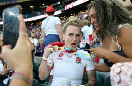 England centre Megan Jones (L) celebrates after their 33-13 Women's Rugby World Cup final win over Canada at Twickenham last year