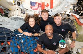 Christina Koch (L), Jeremy Hansen (top), Reid Wiseman (R), and Victor Glover (bottom) posing for a group photo inside the Orion spacecraft on April 7, 2026