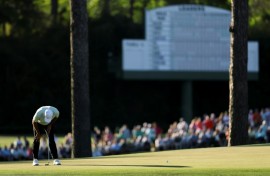 World number one Scottie Scheffler reacts after a missed putt on the 15th green during the first round of the 90th Masters
