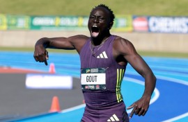 Gout Gout celebrates winning the 200m in 19.67 seconds at the Australian Athletics Championships in Sydney