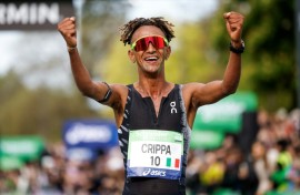 Italy's Yemaneberhan Crippa celebrates after winning the Paris marathon