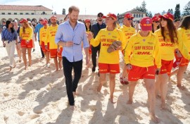 Britain's Prince Harry and his wife meet with volunteer first responders at Bondi Beach in Sydney.