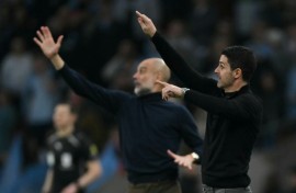 Pep Guardiola's (L) Manchester City are trying to usurp Mikel Arteta's (R) Arsenal at the top of the Premier League