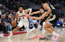 Cade Cunningham of the Detroit Pistons drives during an NBA game against the Milwaukee Bucks