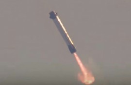 This screen grab taken from a Blue Origin broadcast shows the booster of Blue Origin's New Glenn rocket preparing to land on a floating platform in the Atlantic Ocean
