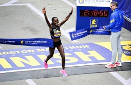 Kenya's Sharon Lokedi celebrates defending her Boston Marathon title