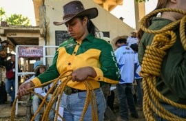 Rizza Matutino preparing to compete in the casting down event during the Rodeo Festival in Masbate