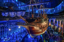 Visitors under the Galeon Espiritu Santo, a full-scale representation of a 17th century galleon, on display at the Museo del Galeon in Manila