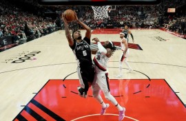 Stephon Castle of the San Antonio Spurs attempts a layup in the Spurs' victory over the Portland Trail Blazers in game three of their NBA playoff series