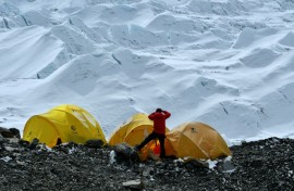 In 2021 photograph, a climber looks at the Khumbu icefall from Everest base camp