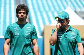 Good vibrations: Aston Martin drivers Lance Stroll and Fernando Alonso walk in the paddock before the Miami Grand Prix