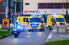 A convoy of ambulances believed to be carrying passengers evacuated from the cruise ship is escorted by Dutch police on motorcycles as it arrives at Leiden University Medical Center