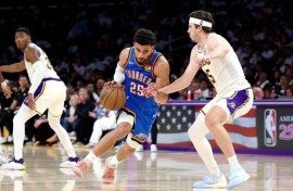 Oklahoma City's Ajay Mitchell drives to the basket against Austin Reaves of the Los Angeles Lakers in the Thunder's win in game three of their NBA playoff series
