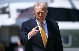 US President Donald Trump, pictured boarding Air Force One on May 12, 2026, notified Congress of strikes against Iran in early March