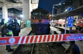 The driver of a train that collided with a bus in Bangkok was charged with negligence causing injury and death