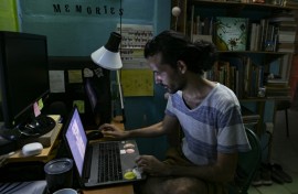 Alejandro Benitez a fourth-year Cuban architecture student, works during the night to try finish assignments that get delayed by incessant power outages