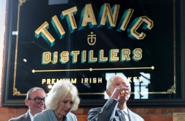 Charles and Camilla sample whiskey during a visit to Titanic Distillers in Belfast, Northern Ireland