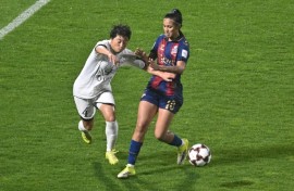 North Korea's Naegohyang Women's FC defender Ri Myong Gum (left) vies for the ball with South Korea's Suwon FC Women forward Mileninha Barreto de Oliveira during their Women's Asian Champions League semi-final at Suwon Sports Complex