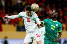 Morocco striker Brahim Diaz (L) heads the ball past Senegal captain Sadio Mane during the 2025 Africa Cup of Nations final in Rabat.
