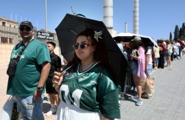 Fans queue outside the Estadi Olimpic Lluis Companys in Barcelona ahead of Bad Bunny's first concert in the Spanish city