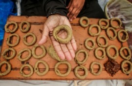 Very few Palestinians are able to make Eid biscuits in their tents due to high prices of cooking gas