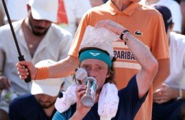 Andrey Rublev used an ice bag to cool off at the French Open on Monday