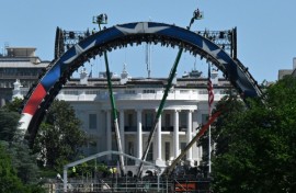 Crews work to build a mixed martial arts arena on the South Lawn of the White House for an upcoming fight that US President Donald Trump is staging as part of celebrations for the country's 250th anniversary