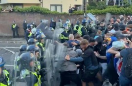 Protesters and police clash at UK rally over student murder
