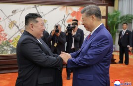 (FILES) This picture taken on September 4, 2025 and released from North Korea's official Korean Central News Agency (KCNA) on September 5, 2025 shows North Korean leader Kim Jong Un (L) shaking hands with Chinese President Xi Jinping in Beijing