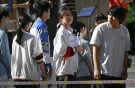 Some students were still cramming as they waited in line to sit the exam