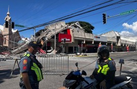 Buildings including a Jolibee restaurant collapsed following a 7.8-magnitude earthquake that hit off Mindanao island