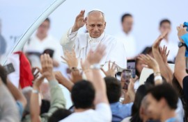 Pope Leo XIV greets the crowd as he arrives to attend a prayer vigil at the Olympic Stadium in Barcelona on June 9
