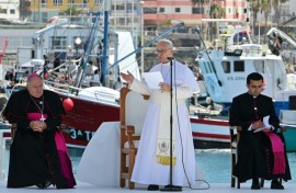 Pope Leo XIV delivers a speech during a meeting with organizations working with migrants in the port of Arguineguin on the Canary Island of Gran Canaria, a place accustomed to the arrival of migrants