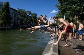 Young people dived into the Canal Saint-Martin in Paris to beat the heat