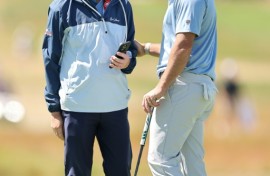 World number two Rory McIlroy, right, speaks with coach Phil Kenyon during a practice round ahead of the 126th US Open at Shinnecock