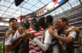 Folarin Balogun celebrates with his teammates after scoring the United States' third goal against Paraguay on June 12, 2026. The hosts went on to win 4-1 in the Group D match at Los Angeles Stadium