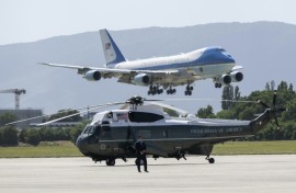 Air Force One carrying US President Donald Trump lands at the Geneva Airport with Marine One helicopter in the foreground ahead of the G7 summit