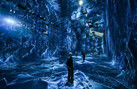 Attendees interact with immersive visualizations from the inaugural exhibition Machine Dreams: Rainforest are projected at DATALAND, the Museum of AI Arts